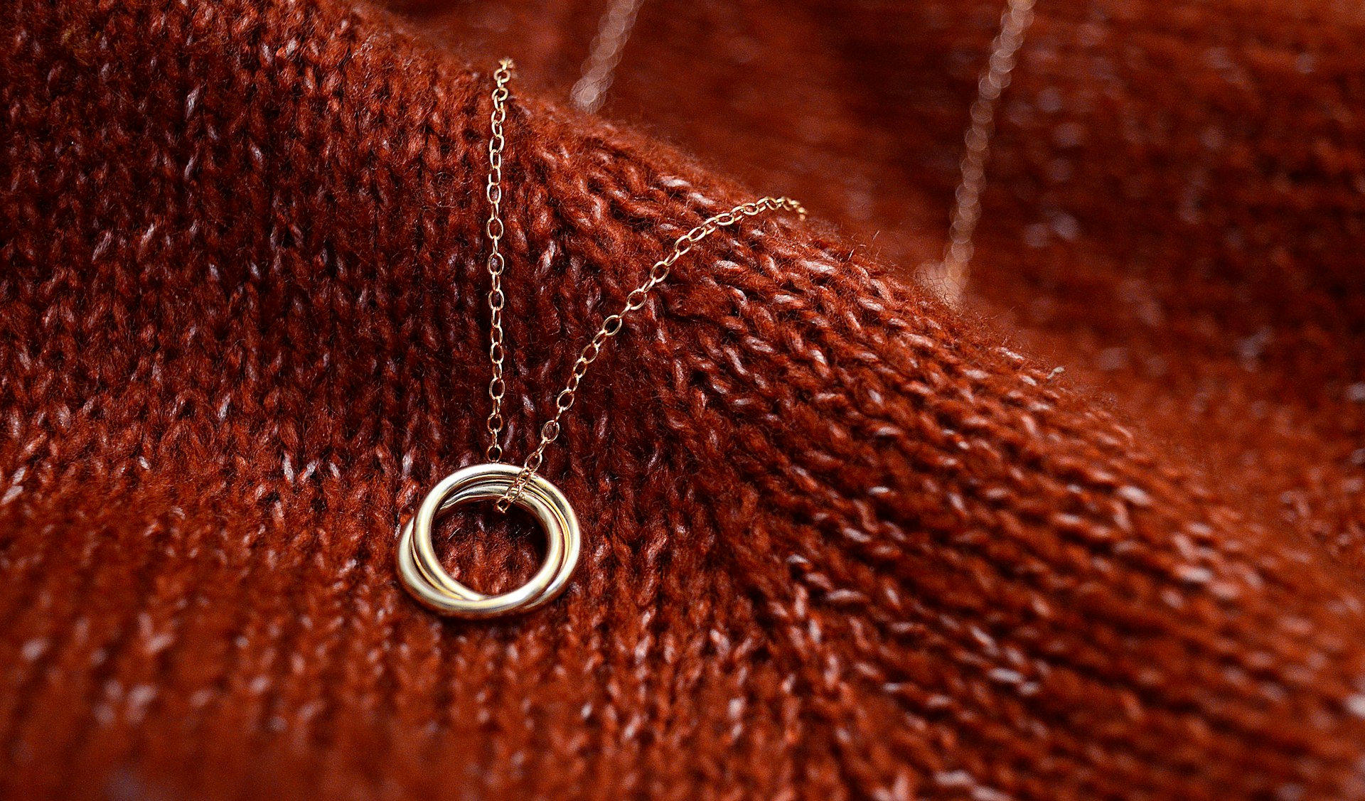 silver ring on brown textile